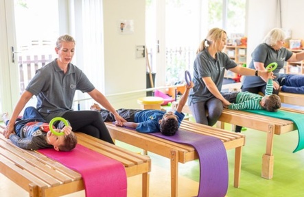 Nursery staff  promote Conductive Education to develop greater bodily control. Credit: Rainbow Hub