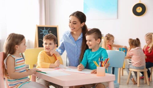A nursery key worker with her 3 key children